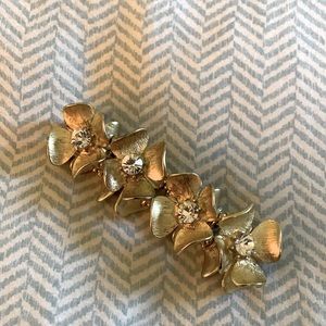 Gold plated floral bracelet with rhinestones